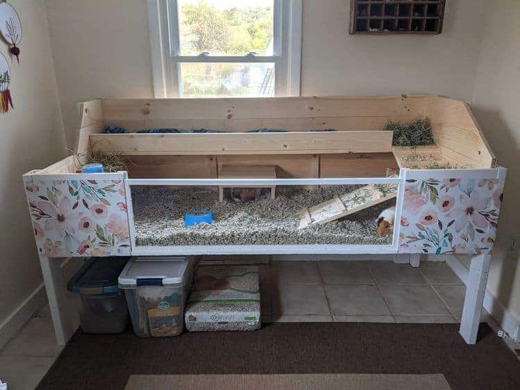 Wooden guinea pig cage with two levels.